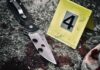 Court Nukes 68-Year Knife Myth Folding knife beside evidence marker on gritty surface