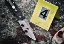 Court Nukes 68-Year Knife Myth Folding knife beside evidence marker on gritty surface