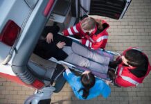 Disneyland Death Sparks Wild Speculation Paramedics load a patient on a stretcher into an ambulance